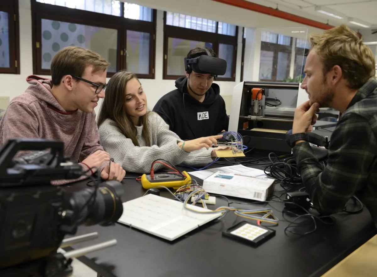 Students are taught multimedia by their teacher