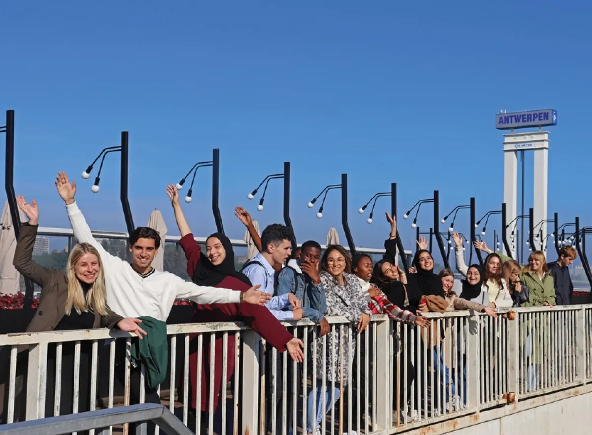 Students in Antwerp at Scheldt river