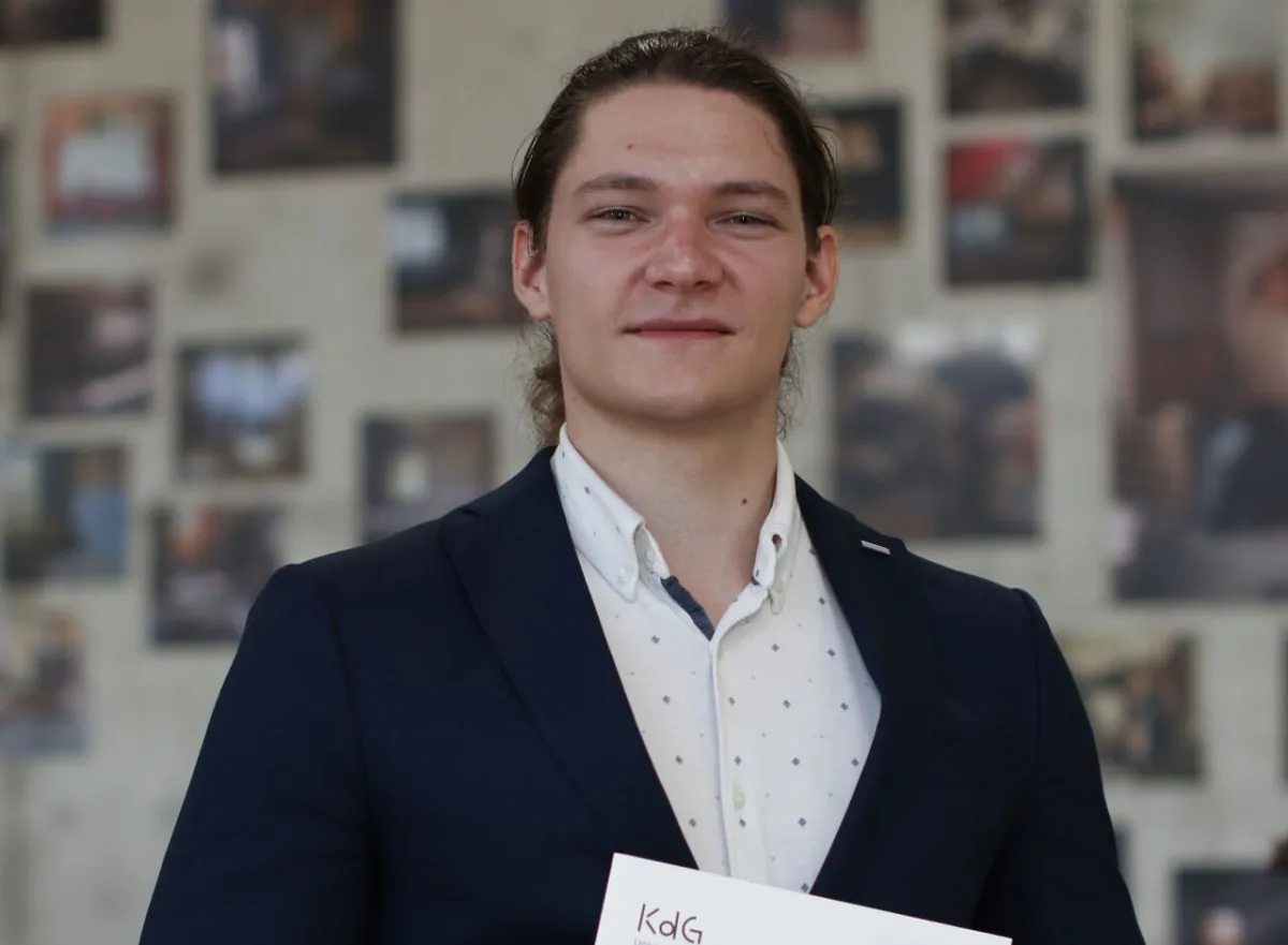 Paul with his degree certificate